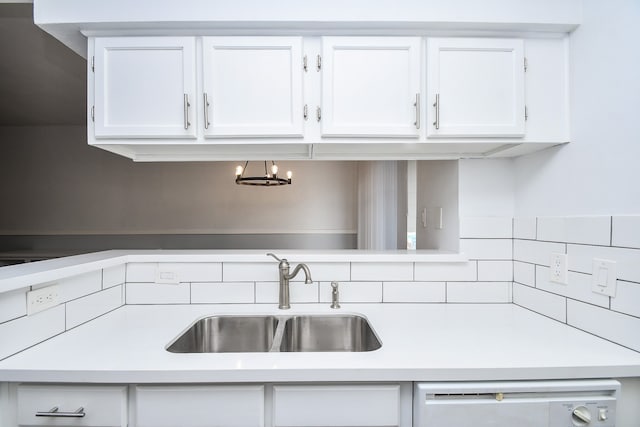 kitchen featuring white cabinetry, sink, and dishwasher