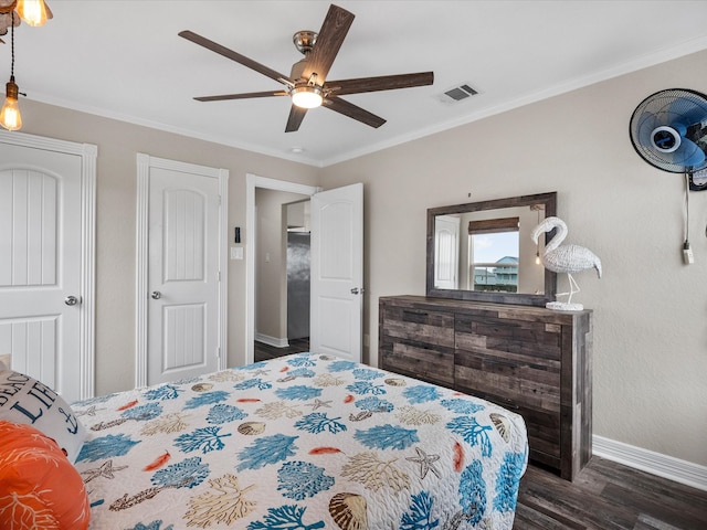 bedroom with ceiling fan, dark hardwood / wood-style floors, and ornamental molding