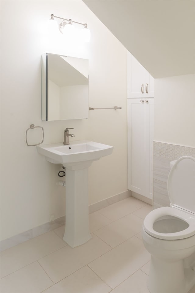 bathroom featuring tile patterned flooring and toilet