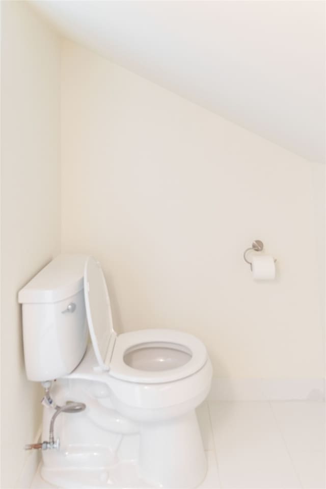 bathroom with tile patterned flooring and toilet