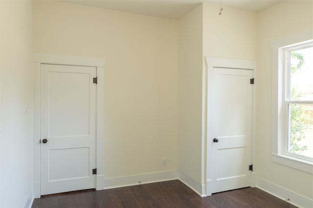 unfurnished room featuring dark hardwood / wood-style floors