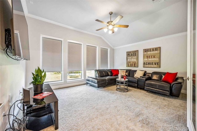 living room with vaulted ceiling, ornamental molding, ceiling fan, and carpet