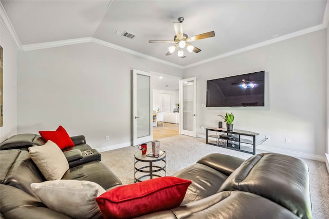 living room featuring light carpet, crown molding, lofted ceiling, and ceiling fan