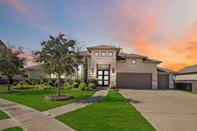 view of front facade featuring a lawn and french doors