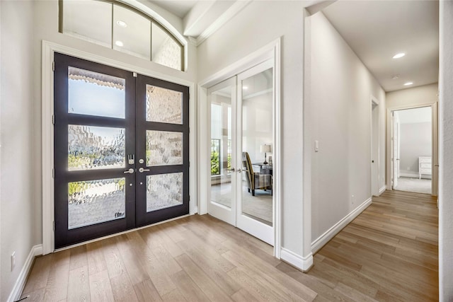 foyer with french doors and light wood-type flooring