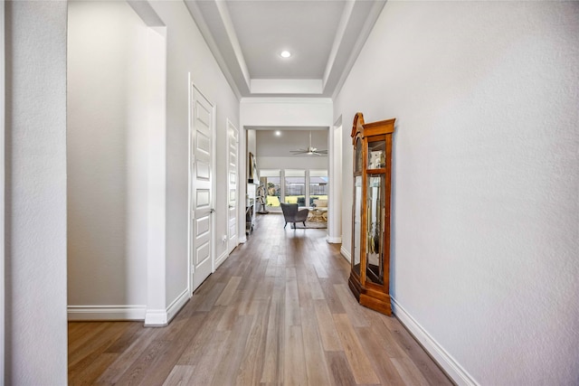 corridor with light hardwood / wood-style floors