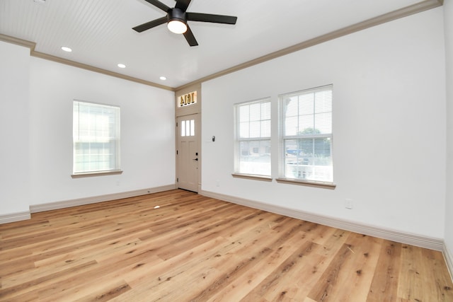 interior space featuring ceiling fan, ornamental molding, and light hardwood / wood-style flooring