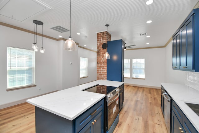 kitchen with blue cabinets, hanging light fixtures, light hardwood / wood-style flooring, ornamental molding, and stainless steel appliances