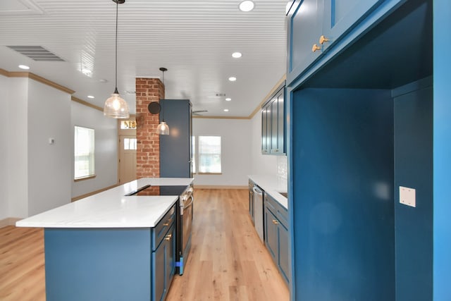 kitchen featuring appliances with stainless steel finishes, decorative light fixtures, blue cabinets, and light hardwood / wood-style flooring