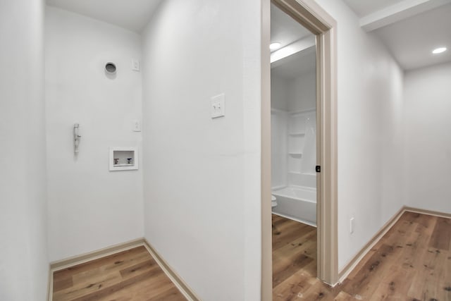 interior space featuring  shower combination and hardwood / wood-style floors