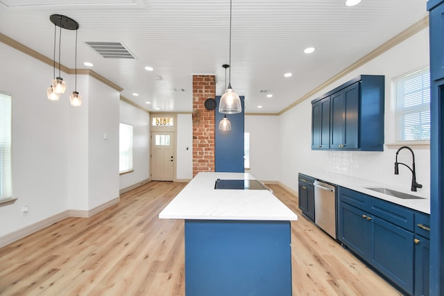 kitchen with sink, stainless steel dishwasher, blue cabinetry, and decorative light fixtures