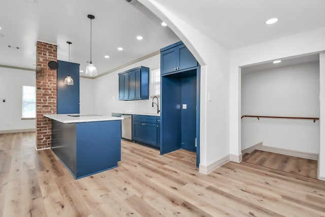 kitchen with blue cabinets, backsplash, hanging light fixtures, stainless steel dishwasher, and light hardwood / wood-style floors