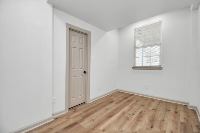 spare room featuring light wood-type flooring