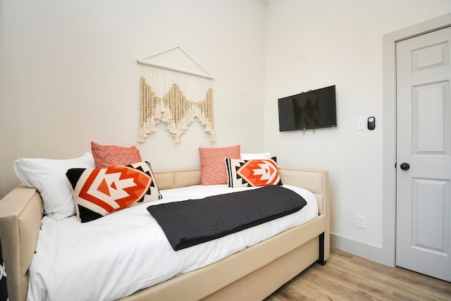 bedroom with light wood-type flooring