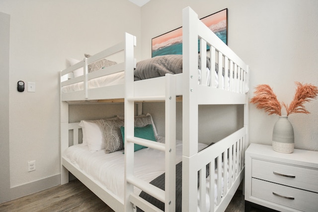 bedroom featuring dark hardwood / wood-style flooring