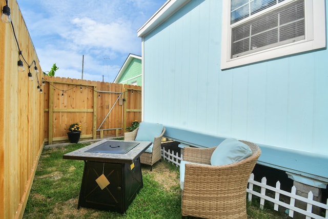 view of patio / terrace with an outdoor fire pit