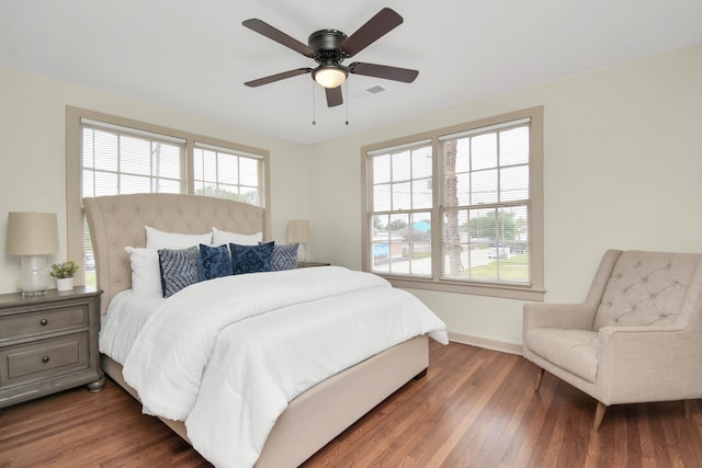 bedroom featuring ceiling fan and dark hardwood / wood-style floors