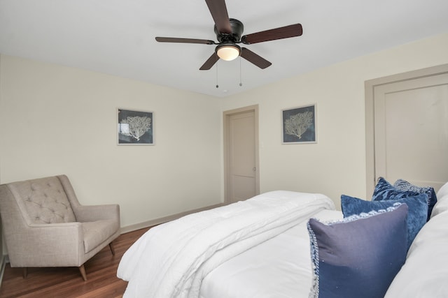 bedroom featuring dark hardwood / wood-style flooring and ceiling fan