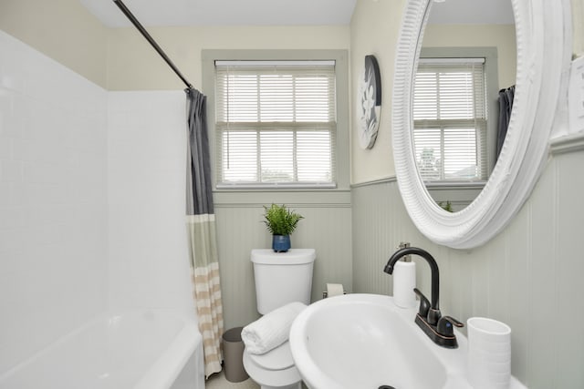 full bathroom with shower / bath combo, sink, and toilet