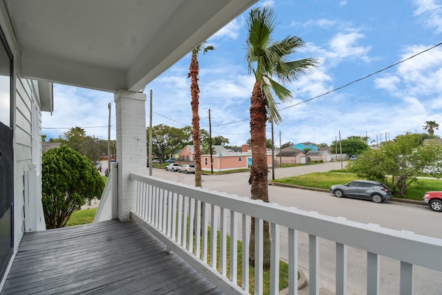 wooden terrace featuring covered porch