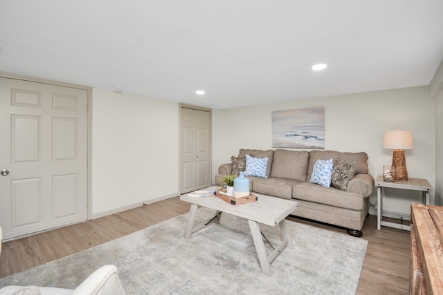 living room with light hardwood / wood-style flooring