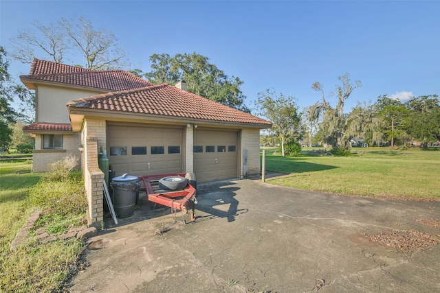 garage with a lawn