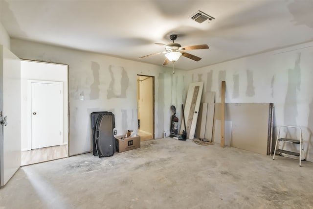 living room with concrete flooring and ceiling fan