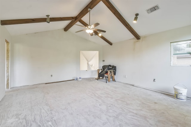 spare room featuring ceiling fan and lofted ceiling with beams