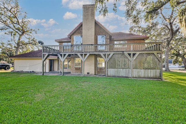 back of house with a wooden deck and a yard