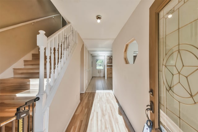 foyer with light hardwood / wood-style floors