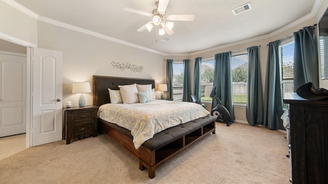 carpeted bedroom featuring ceiling fan and ornamental molding