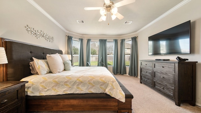 carpeted bedroom featuring ceiling fan and crown molding