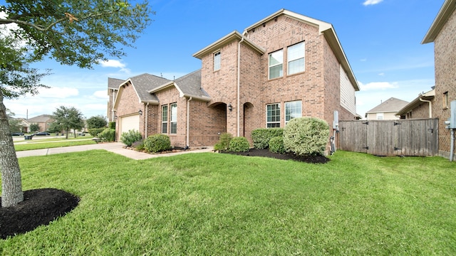 front of property featuring a front yard and a garage