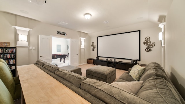 carpeted home theater room with vaulted ceiling and pool table