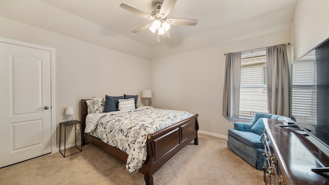 bedroom featuring light colored carpet and ceiling fan