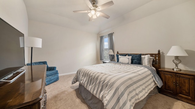 carpeted bedroom featuring vaulted ceiling and ceiling fan