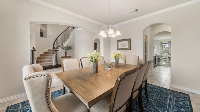 tiled dining space with a chandelier and ornamental molding