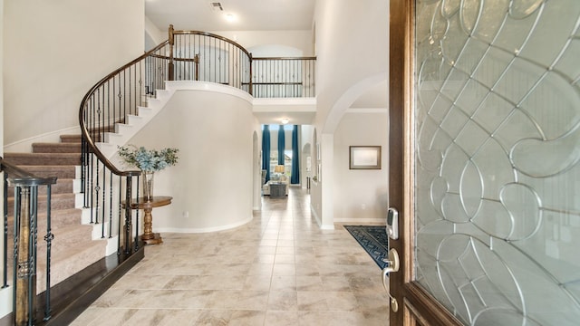 foyer featuring a high ceiling