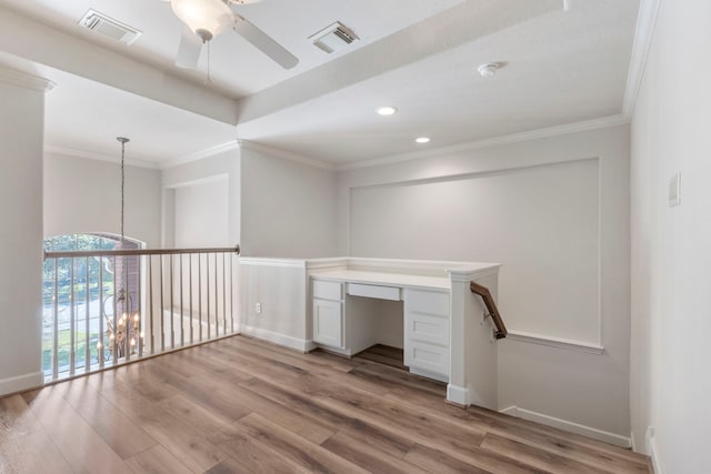 unfurnished office featuring light hardwood / wood-style floors, ceiling fan with notable chandelier, and ornamental molding