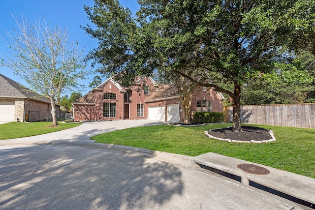 view of front facade with a garage and a front lawn