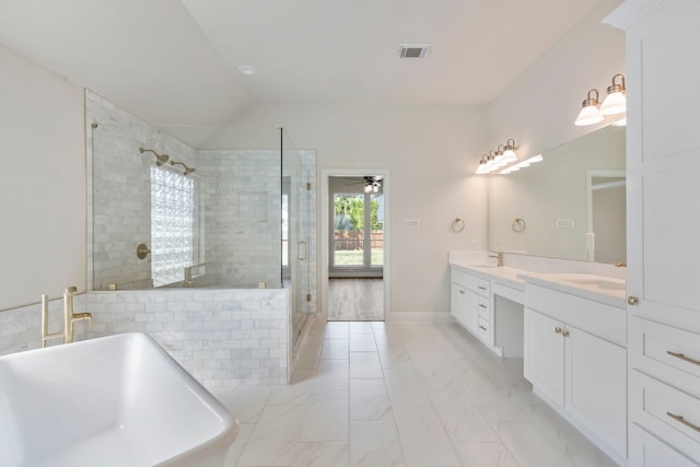 bathroom with vanity, ceiling fan, independent shower and bath, and vaulted ceiling