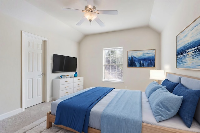 carpeted bedroom with ceiling fan and lofted ceiling