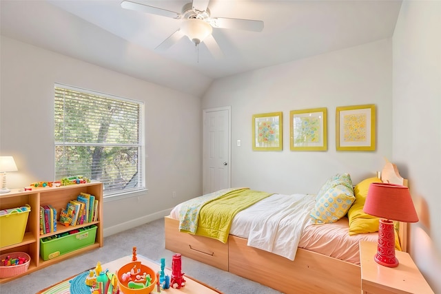 carpeted bedroom with ceiling fan and lofted ceiling