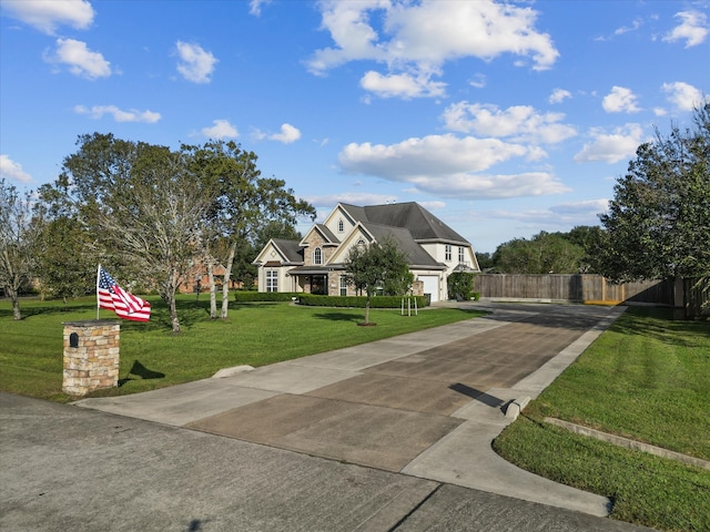 view of front of home featuring a garage and a front lawn