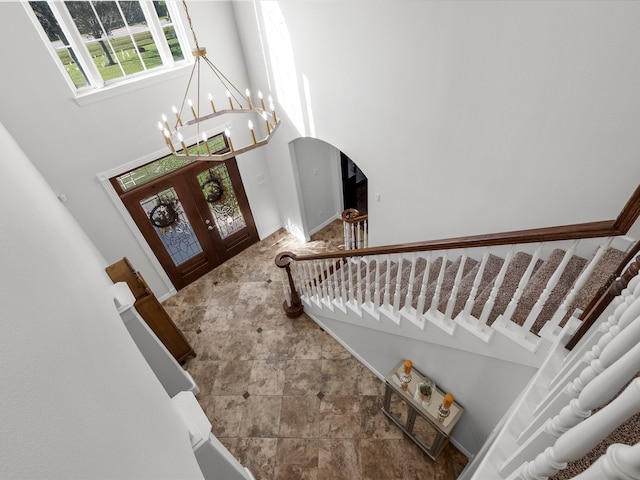 foyer with an inviting chandelier