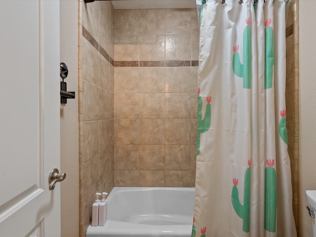 bathroom featuring shower / bath combo with shower curtain and toilet