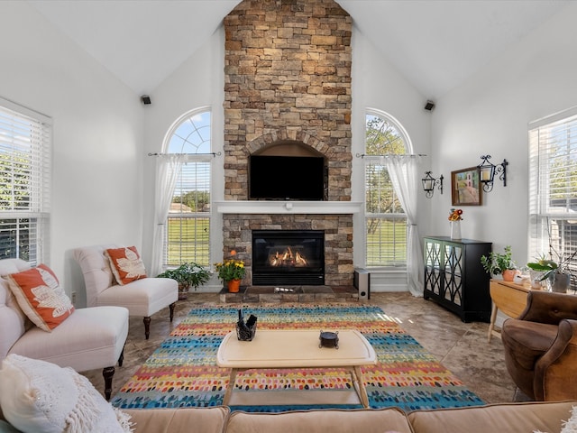 living room featuring a fireplace and high vaulted ceiling