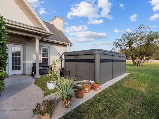 garage featuring a lawn