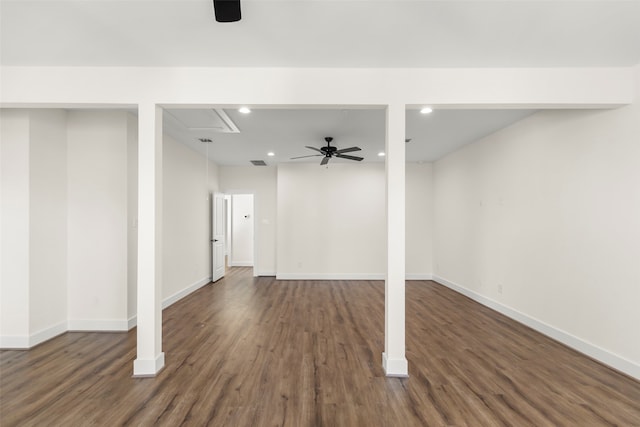 basement with ceiling fan and dark wood-type flooring