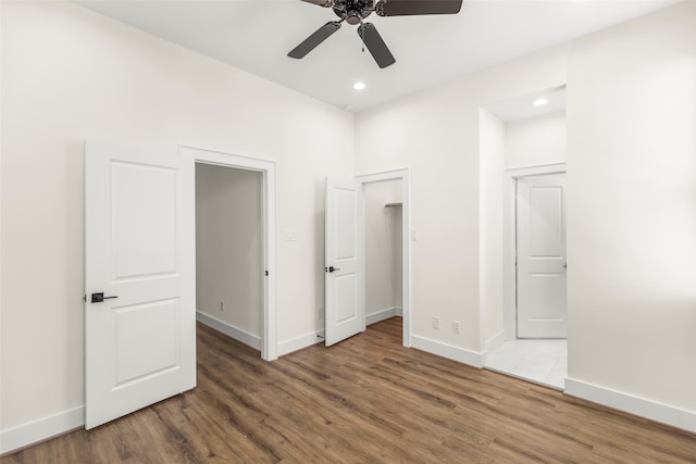 unfurnished bedroom with hardwood / wood-style floors and ceiling fan